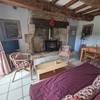 Salon avec poêle -  Gîte SAINTE ANNE LA PALUD (Bretagne, Finistère)